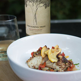 Pecan-Crusted White Fish with Charred Tomatoes, Red Peppers & Lemons