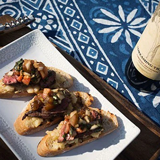 Steak & Braised White Beans on Grilled Bread with a Tomato Salad